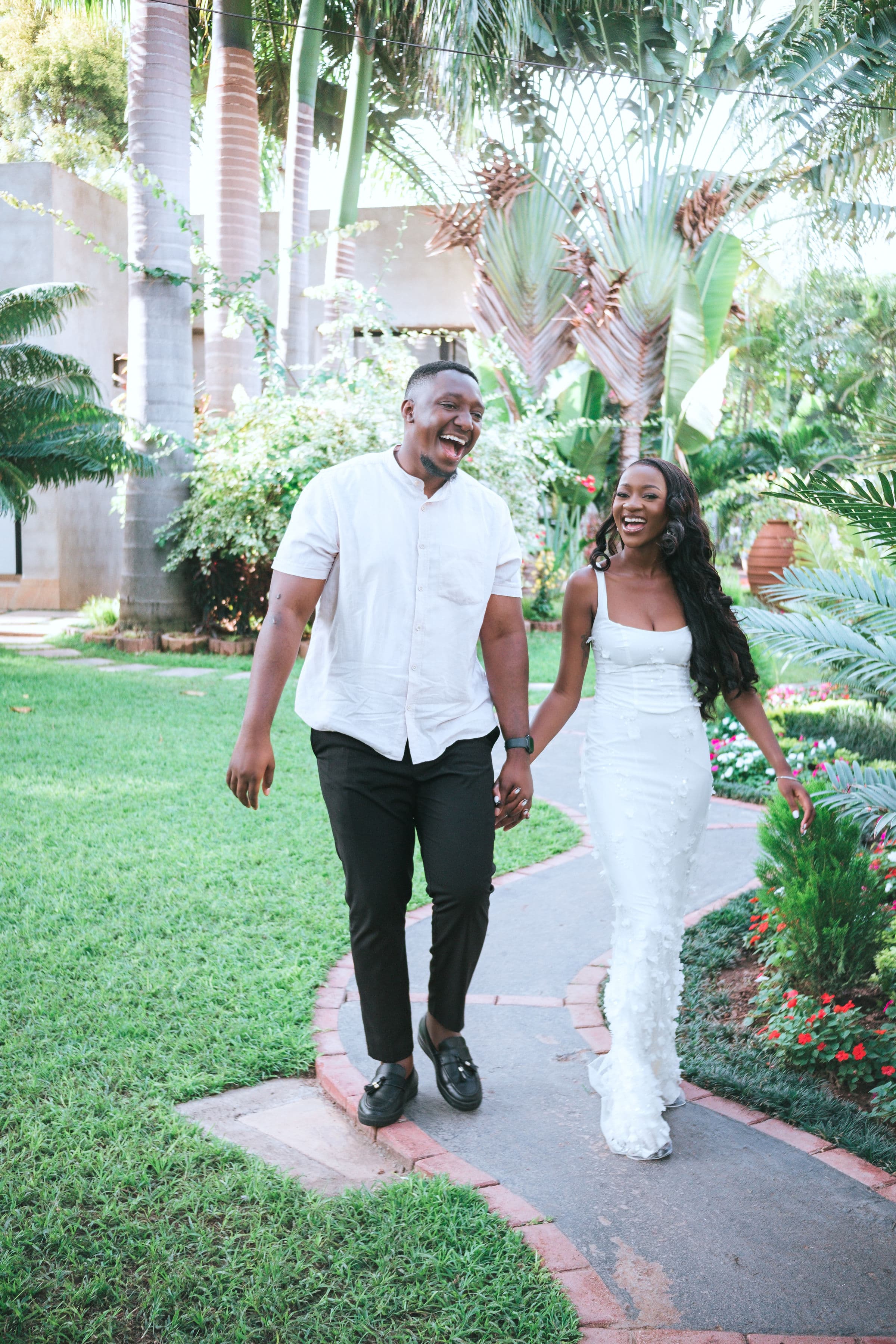 Kafwa and Martina walking together in the garden
